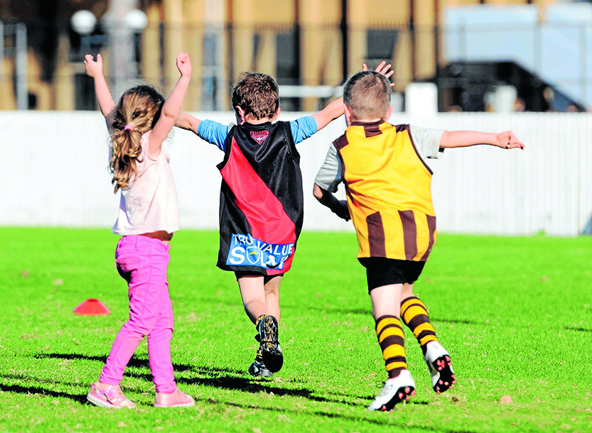 Auskick club kicking goals in Carlton