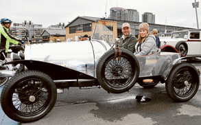 Classic cars line the harbour