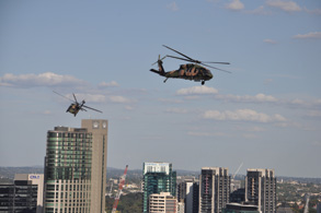 Black Hawk soar over city