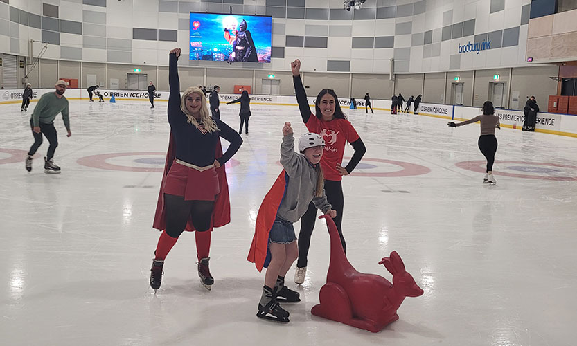 Superheroes skate for an event with heart